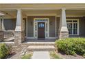 Brick columns and steps lead to a charming double front door entry at 15 Amberly Ln, Cartersville, GA 30121