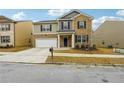 Two-story home with a brick facade and a driveway at 3811 River Rock Rd, Lithonia, GA 30038
