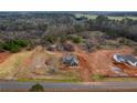 Aerial view of a modern single-Gathering home situated on a spacious lot with a neatly manicured lawn at 181 Woodfin Way, Social Circle, GA 30025