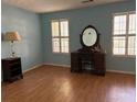Bright bedroom with hardwood floors and antique vanity at 3754 Sidney Lanier Blvd, Duluth, GA 30096