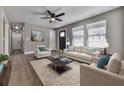 Spacious living room featuring hardwood floors, neutral walls, and a comfy seating area at 445 Milton Dr, Canton, GA 30114