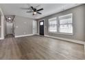 Hardwood floors and neutral walls characterize this spacious living room at 445 Milton Dr, Canton, GA 30114