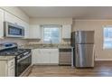 Eat-in kitchen with stainless steel appliances and granite countertops at 2230 Star Mist Sw Dr, Atlanta, GA 30311