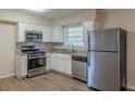 Eat-in kitchen with stainless steel appliances and granite countertops at 2230 Star Mist Sw Dr, Atlanta, GA 30311