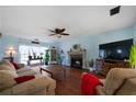 Living room featuring hardwood floors, fireplace, and comfortable seating at 230 Bennett Farms Trl, Acworth, GA 30102