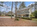 Charming two-story traditional home boasts a 2-car garage and inviting front porch with black shutters at 515 Lees Sw Trce, Marietta, GA 30064