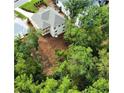 Aerial view of new construction home, showing covered patio and wooded backyard at 4412 Brookview Se Dr, Atlanta, GA 30339