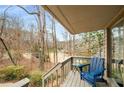 Deck overlooking wooded area with blue Adirondack chair at 3453 Johnson Ferry Ne Rd, Roswell, GA 30075