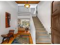 Bright entryway with hardwood floors and staircase at 3453 Johnson Ferry Ne Rd, Roswell, GA 30075