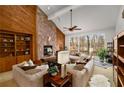 Spacious living room with stone fireplace and high ceilings at 3453 Johnson Ferry Ne Rd, Roswell, GA 30075