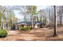 Ranch home with attached garage and a wooded setting at 4653 Flat Bridge Sw Rd, Stockbridge, GA 30281