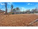 Wide shot of house and yard with autumn leaves at 2401 Prestige Valley Ct, Morrow, GA 30260