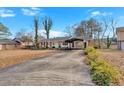 Ranch home with carport and long driveway at 2401 Prestige Valley Ct, Morrow, GA 30260