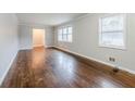 Spacious living room featuring hardwood floors and plenty of natural light at 2937 Cascade Sw Rd, Atlanta, GA 30311