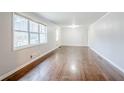 Large living room featuring hardwood floors and lots of windows at 2937 Cascade Sw Rd, Atlanta, GA 30311