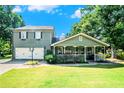 Charming home with a well-manicured lawn, attached garage, and a welcoming front porch at 4656 Bryant Rd, Snellville, GA 30039