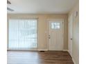 Bright entryway with white door and wood-look floors at 37 Delmoor Nw Ct, Atlanta, GA 30311