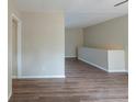 Open living space with wood-look floors and neutral walls at 37 Delmoor Nw Ct, Atlanta, GA 30311