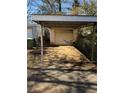 Single car carport with attached storage area at 1423 Graham Sw St, Atlanta, GA 30310