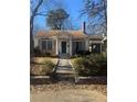 Charming brick home with a classic design and well-maintained landscaping at 1423 Graham Sw St, Atlanta, GA 30310