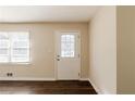 Front entry with white door, hardwood floors and neutral walls at 3582 Swallow Ln, Decatur, GA 30032