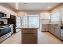 Modern kitchen with granite island and stainless steel appliances at 3693 Aldea Dr, Decatur, GA 30032