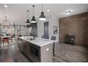 Modern kitchen with island, stainless steel appliances, and white countertops at 244 Castleberry Station Sw Dr, Atlanta, GA 30313