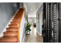 Bright entryway with wood staircase and tile flooring at 3111 Green Gate Se Way, Conyers, GA 30013