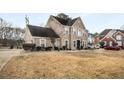 Two-story brick home with a large driveway and side yard at 3111 Green Gate Se Way, Conyers, GA 30013