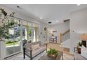 Bright living room with modern furniture, large windows, and a view of the patio at 500 Clover Ln, Alpharetta, GA 30009