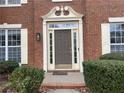 Elegant front entrance with a decorative door and manicured landscaping at 1142 Drewsbury Se Ct, Smyrna, GA 30080