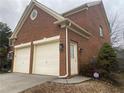Three car garage with off-street parking and side entrance at 1142 Drewsbury Se Ct, Smyrna, GA 30080