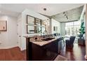 Contemporary kitchen island with granite countertop and dark cabinetry at 250 Pharr Rd # 1707, Atlanta, GA 30305