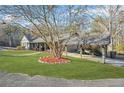 House with carport and mature tree in front yard at 6585 Queen Mill Se Rd, Mableton, GA 30126