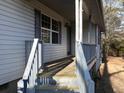 Front porch view with wooden steps and railing at 1463 Hickory Level Rd, Villa Rica, GA 30180