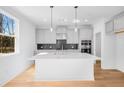 Bright kitchen featuring a center island with stainless steel appliances and stylish backsplash at 31 Bennett Farm Dr, Loganville, GA 30052
