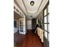Inviting foyer with hardwood floors, a tray ceiling, and a view of the staircase and living spaces at 3857 Felton Hill Sw Rd # 9, Smyrna, GA 30082