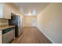 Eat-in kitchen with stainless steel appliances and light wood floors at 2476 Brentford Pl, Decatur, GA 30032