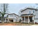 Two-story houses under construction on a lot at 369 Marigna Ave, Scottdale, GA 30079