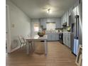 Modern kitchen with light grey cabinets and a granite countertop at 303 Latimer Se St, Marietta, GA 30008