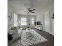 Bright living room with comfy seating and a large TV at 303 Latimer Se St, Marietta, GA 30008