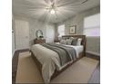 Spacious primary bedroom with a wooden bed frame and neutral decor at 303 Latimer Se St, Marietta, GA 30008