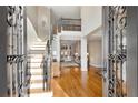 Two-story entry with hardwood floors and wrought iron staircase at 3134 Denton Ne Pl, Roswell, GA 30075