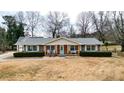 Ranch home with large yard, showcasing the front and side of house at 3649 Pinehill Cir, Acworth, GA 30101