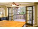 Kitchen with french doors leading to a deck and screened porch at 4770 Quail Hunt Ct, Powder Springs, GA 30127