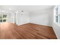 Spacious living room featuring hardwood floors and natural light streaming through the windows at 382 Northdale Ct, Lawrenceville, GA 30046