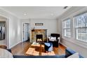 Living room features a cozy fireplace and hardwood floors at 2856 Hosea L Williams Ne Dr, Atlanta, GA 30317