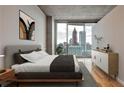 Bedroom showcasing city views, neutral tones, and contemporary furnishings at 860 Peachtree Ne St # 2506, Atlanta, GA 30308