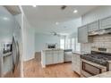 Modern kitchen with stainless steel appliances and granite countertops at 2075 Carlysle Park Ln, Lawrenceville, GA 30044