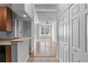Bright hallway with hardwood floors and exposed beams at 32 Peachtree Nw St # 804, Atlanta, GA 30303